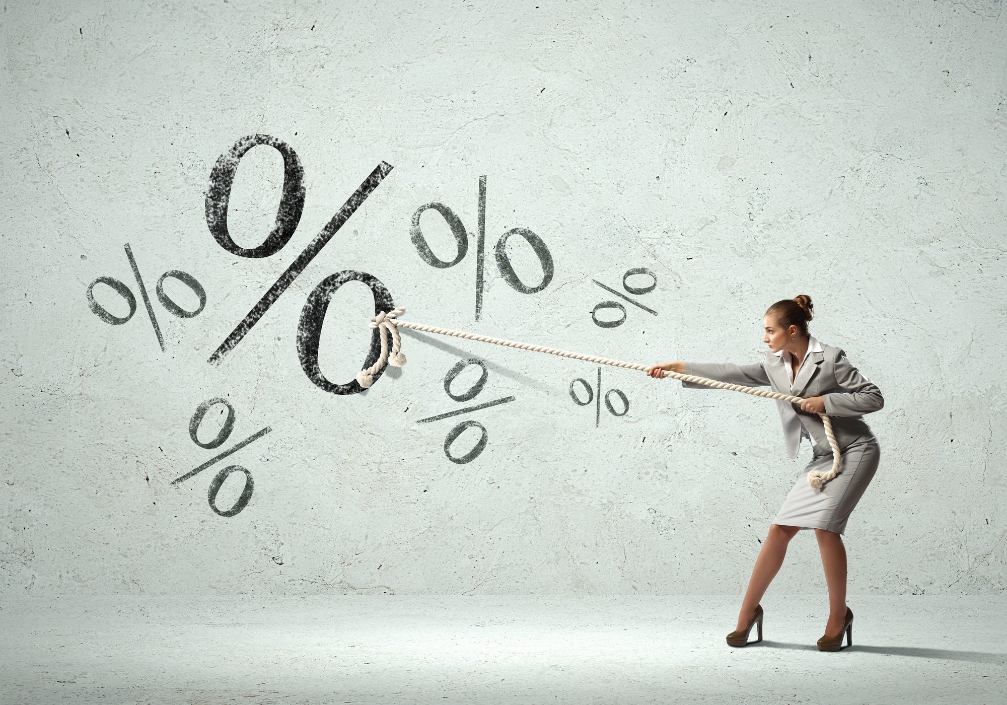 Businesswoman pulling rope