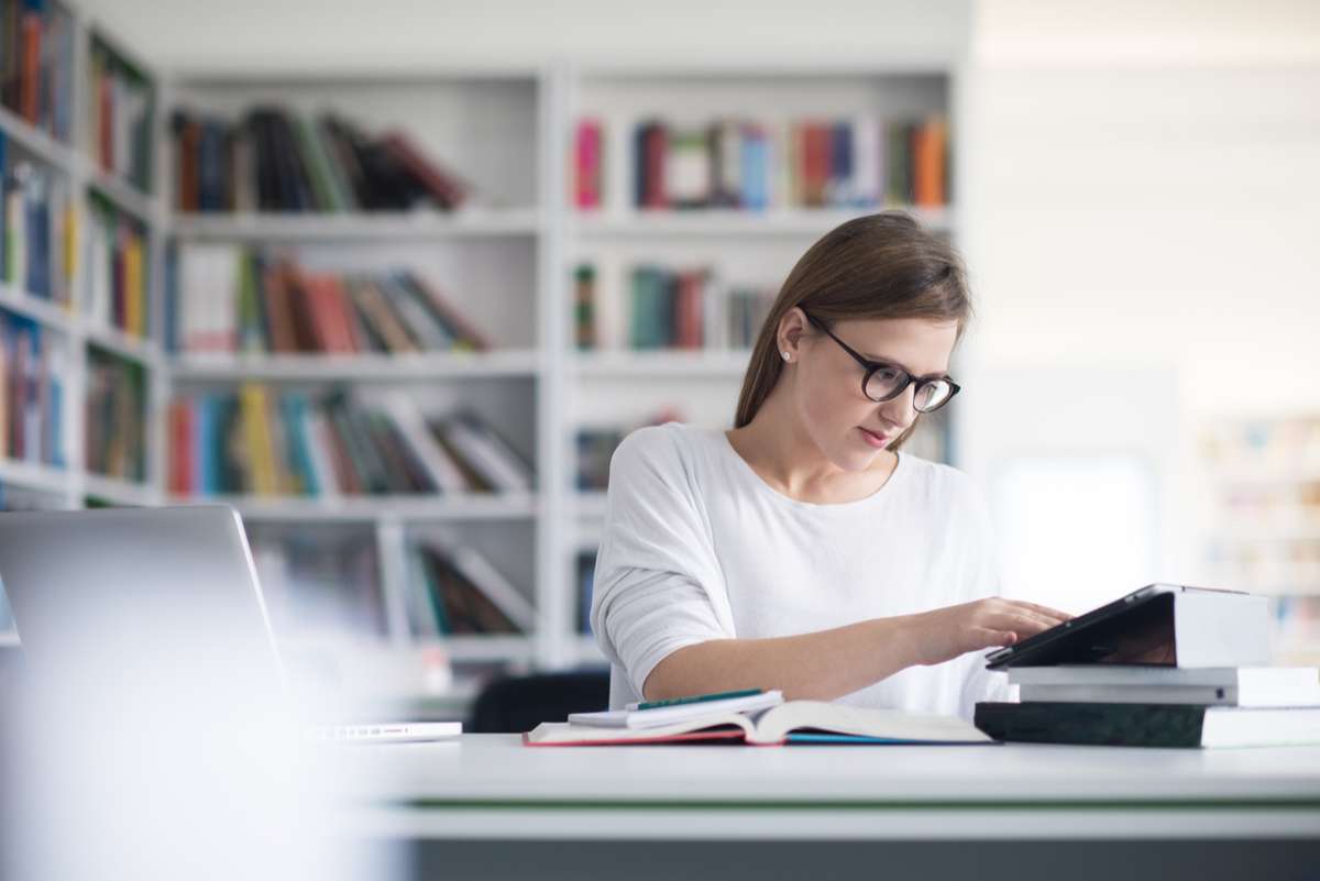 Female student study in school library (R) (S)