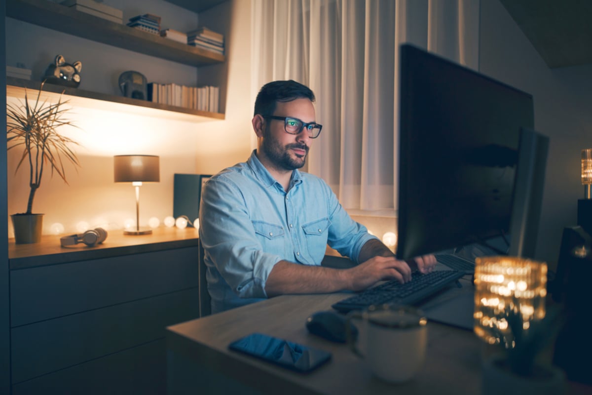 Modern young man working remotely from home