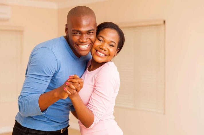 Couple dancing in house