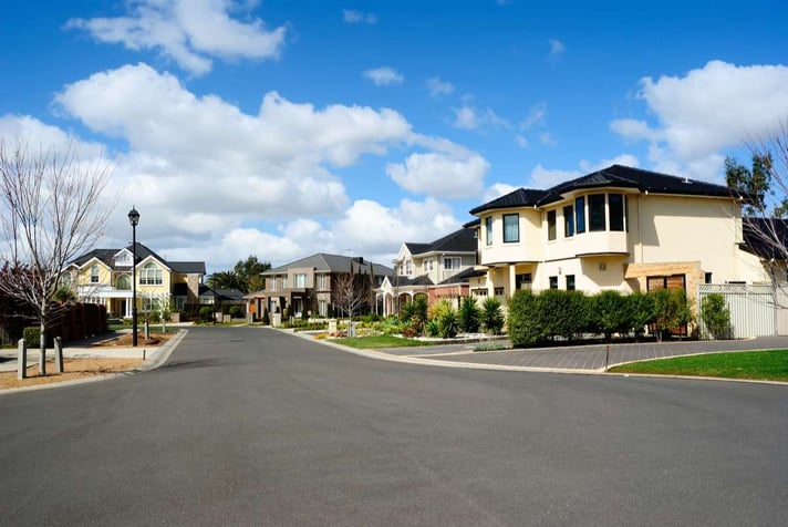 Modern houses in a suburban neighborhood, optimizing rental property maintenance concept. 