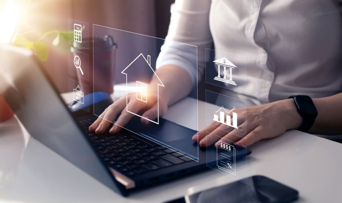 Businesswoman working on laptop on a profitable business from real estate investments