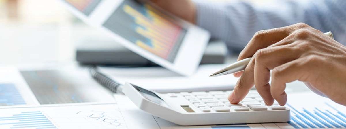 Close up of male accountant or banker making calculations